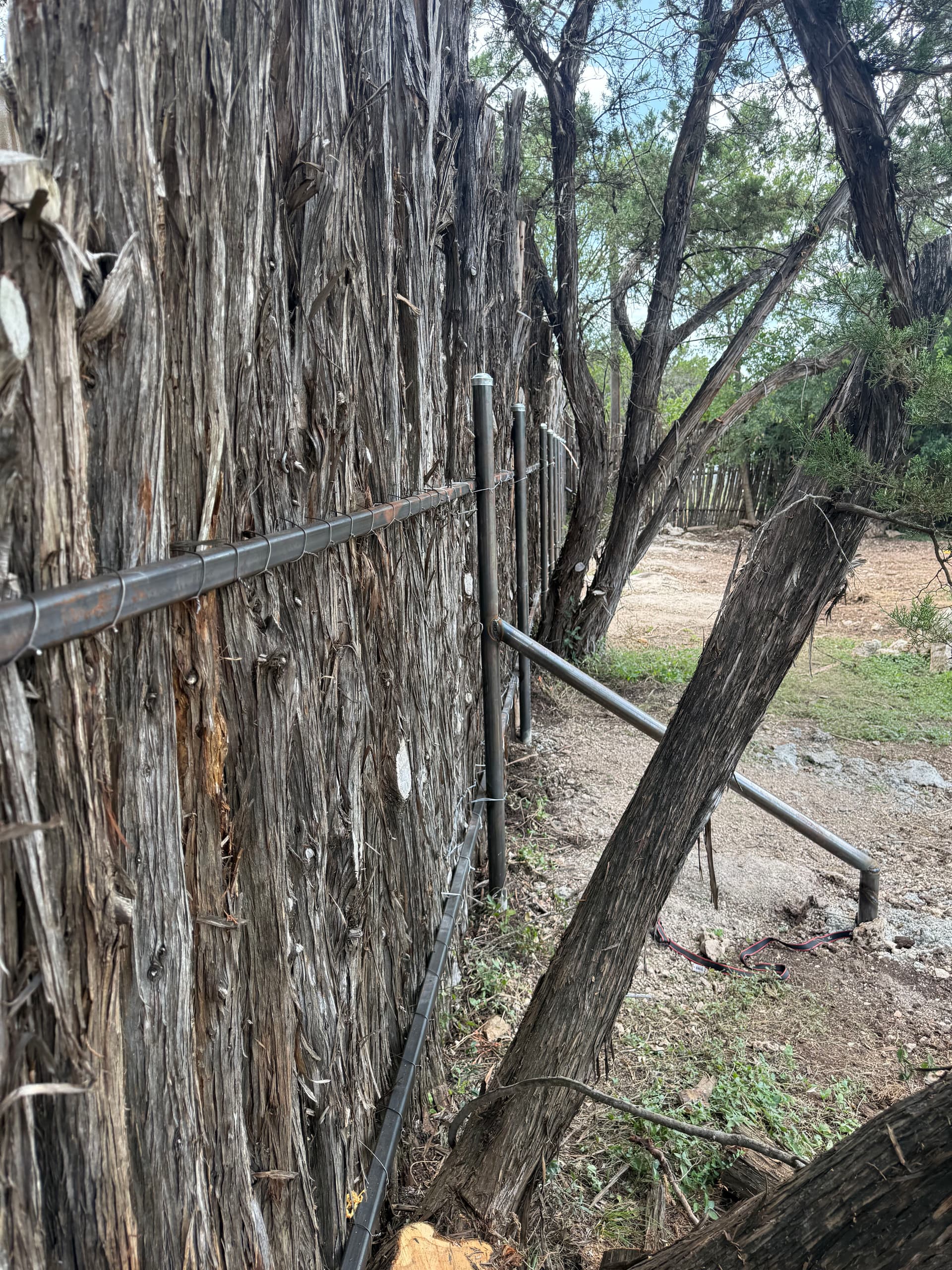 Gallery photos for Steel and Cedar Stave Fence Built for Privacy in Wimberley: Image #1